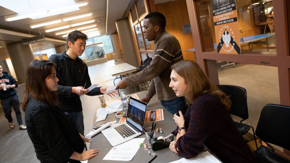 Vote 100 kiosk with students