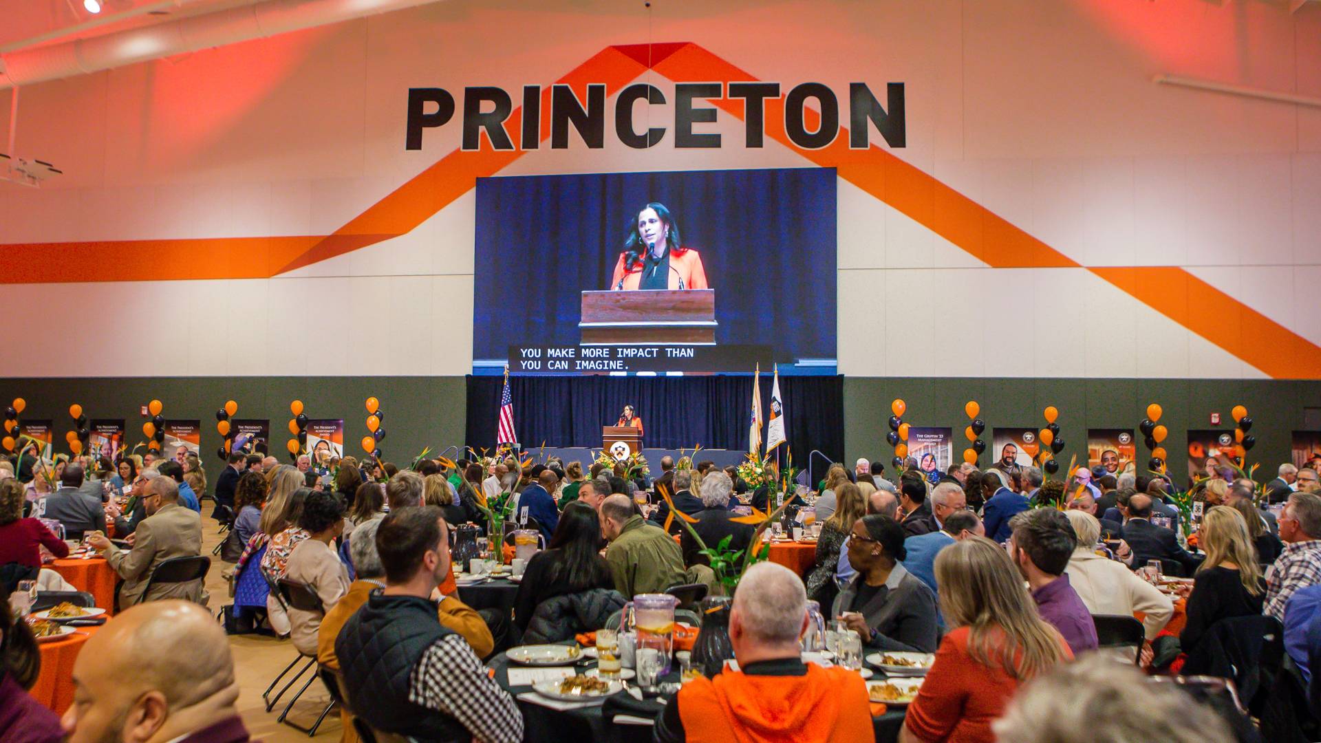 Luncheon attendees watch a presentation