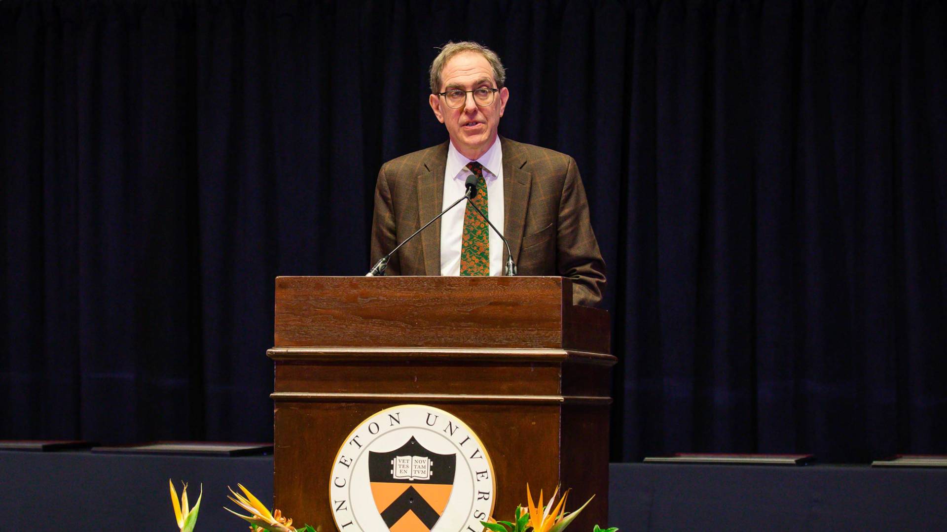 President Eisgruber speaking at podium