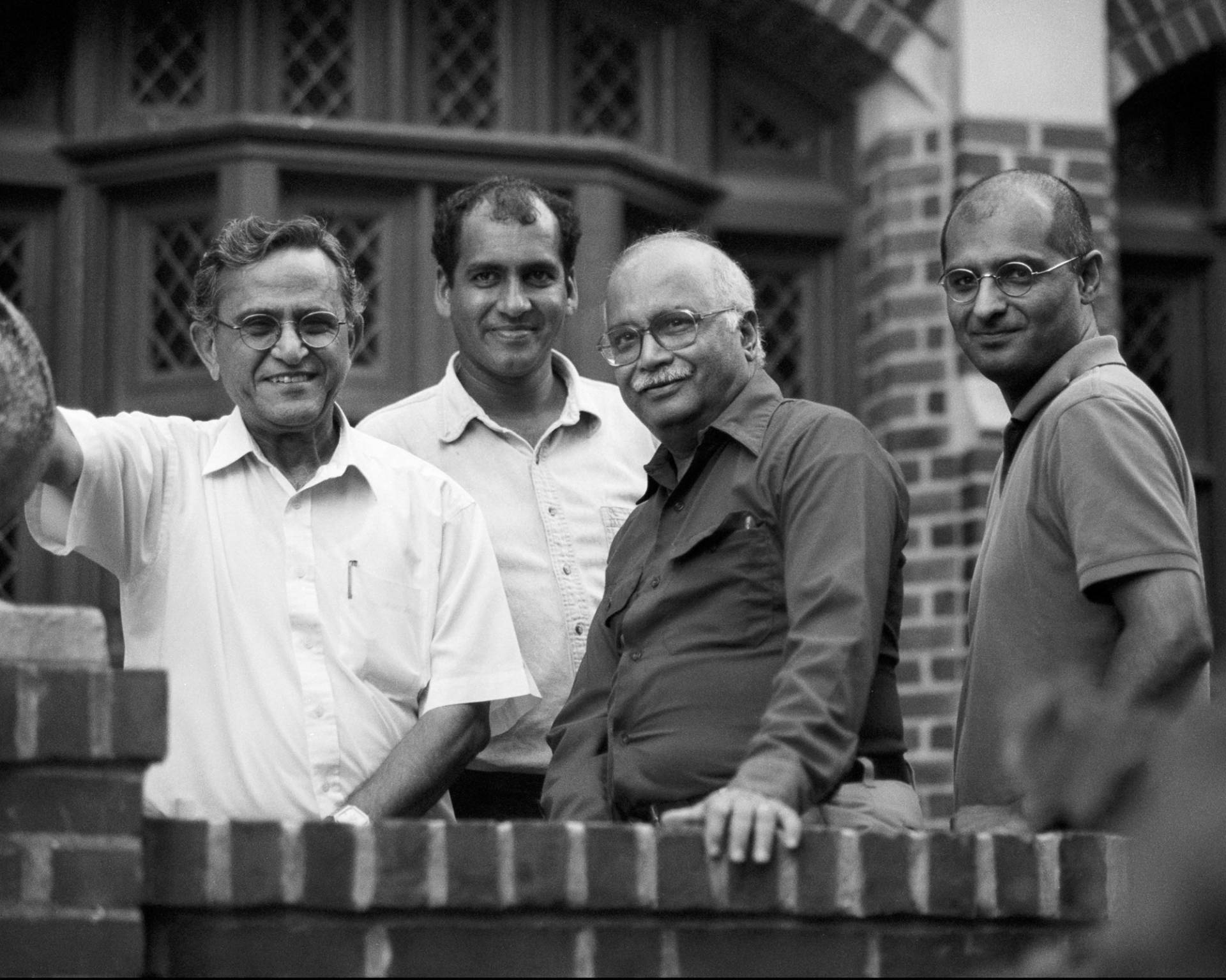 Four SGS physicists with the program’s Project on Peace and Security in South Asia pose together in front of a building.